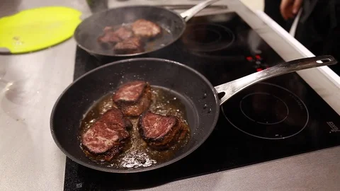 Chef cook fried meat steak in pan Stock Footage 113016725