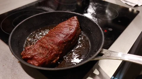 Chef cook fried meat steak in pan Stock Footage 113016771