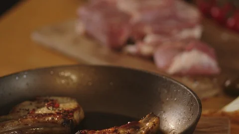 Chef cook fried meat steak in pan Stock Footage 125167719