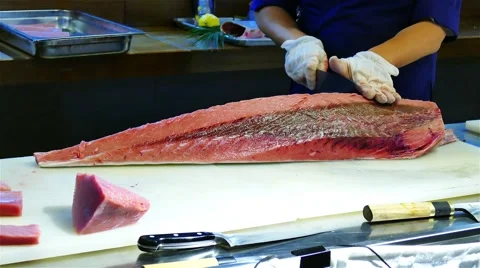 Chef cook hands cutting with knife bluefin tuna fish 4k video. Japanese cuisine Stock Footage 67487839