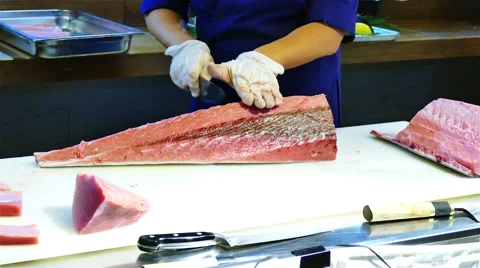 Chef cook hands cutting with knife tuna fish fillet 4k video. Japanese cuisine Stock Footage 67487843