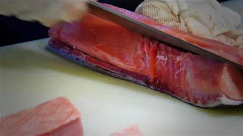 Chef cook hands cutting with knife tuna fish fillet 4k video. Japanese cuisine Stock Footage 67487847