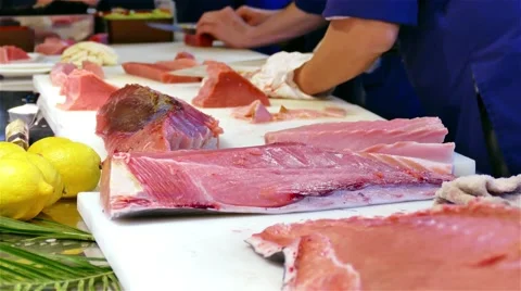 Chef cook hands knife cutting tuna fish fillet 4k video. Sushi Japanese cuisine Stock Footage 67487871