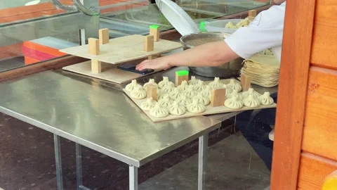 Chef cook make khinkali on silver table. Process and preparation georgian mea Vídeos de archivo 194850670