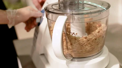 Chef cook milled nuts in a blender in kitchen Stock Footage 111072336