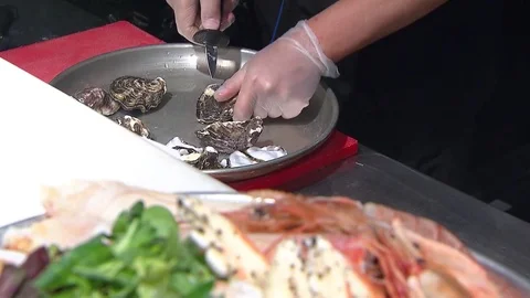A chef cook opens oysters Stock Footage 85460915