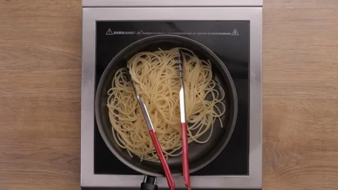 Chef Cook Puts Down A Spaghetti In A Steel Pot Preparing Italian Food Video stock 163830573