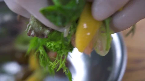Chef cook putting prepared salad on white plate on restaurant kitchen. Food Video stock 104540963