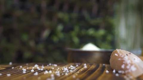 Chef cook putting raw chicken fillet on wooden table. Hand of cook preparing Stock Footage 98768775