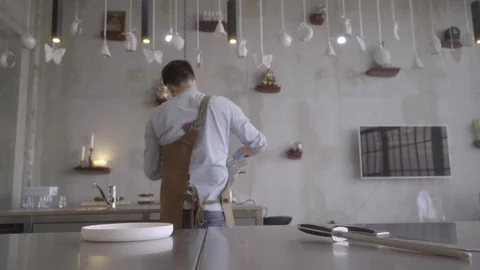 Chef / Cook putting the slices of red beet on a white plate. Stock Footage 93849628