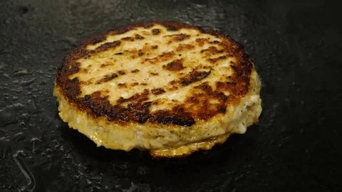 Chef cooking and flip over juicy meat burger patty, street food, 4K 60 FPS Stock Footage 76897597