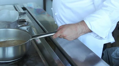 Chef cooking and preparing food in restaurant kitchen. Stock Footage 48471039