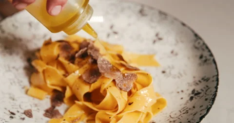 Chef cooking and serving pasta in fine dining restaurant. Stock Footage 178582729