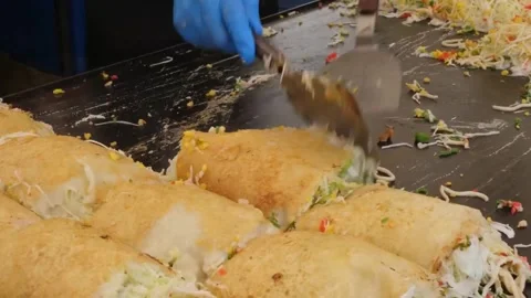 Chef Cooking Authentic Hiroshima Style Okonomiyaki on Flat-Top Teppan Griddle - Stock Footage 347688893