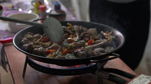 Chef cooking authentic spanish paella with chicken feet Stock-Footage 319072269