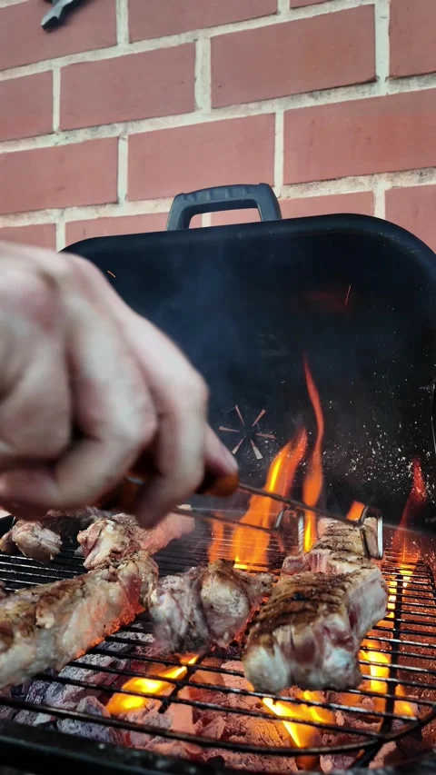 Chef cooking bbq in home backyard. Summer barbecue party. Vertical video Stock Footage 279018052