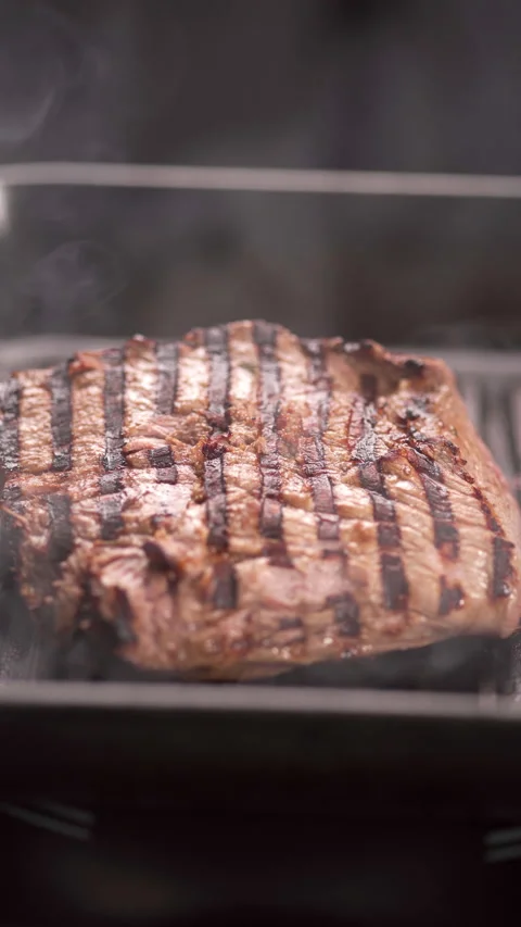Chef cooking Beef steak frying on a grill pan in a professional restaurant Stock Footage 271133151