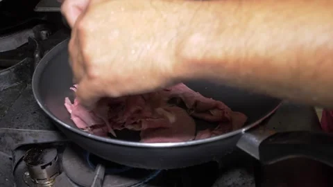 Chef Cooking Beef Straccetti Over High Flame in a Sizzling Pan Stock-Footage 336793690