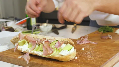 Chef Cooking Bread Sandwich With Fresh Cucumber, Beef Ham, Cheese In Kitchen. 動画素材 151922791