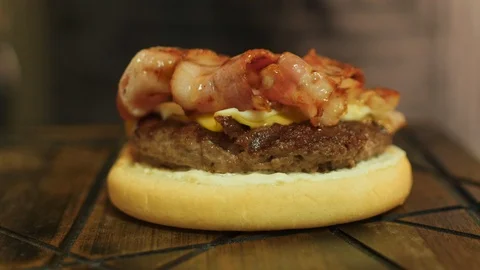 Chef Cooking a Cheeseburger with Bacon Stock Footage 95187130