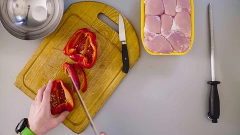 Chef cooking a chicken dish. Cutting paprika Stock Footage 88740924