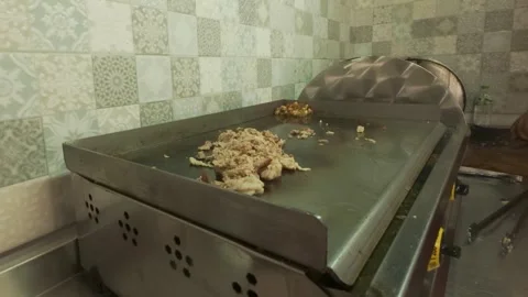 Chef Cooking Chopped Kokorec on Hot Flat Top Grill Gridle Stock Footage 337205870