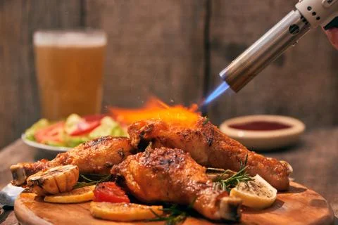 Chef cooking of Crispy Fried Chicken on wooden board background in the restau Stock Photos
