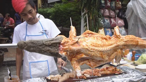 Chef Cooking Crocodile Roast BBQ Stock Footage 100741300
