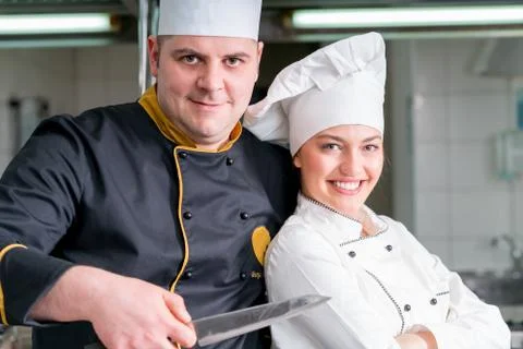 Chef Cooking, Cutting and preparing next plate Stock Photos