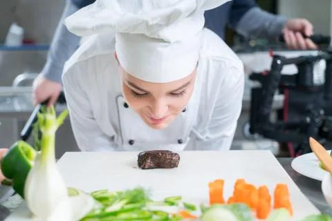 Chef Cooking, Cutting and preparing next plate Stock Photos