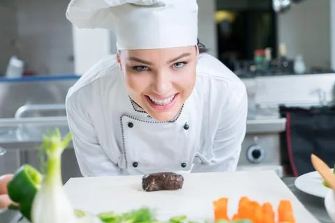 Chef Cooking, Cutting and preparing next plate Stock Photos
