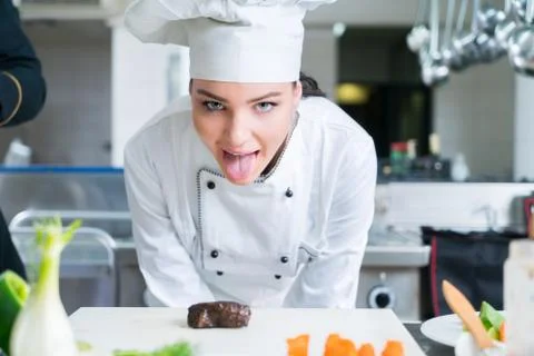 Chef Cooking, Cutting and preparing next plate Stock Photos