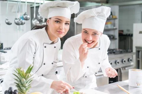 Chef Cooking, Cutting and preparing next plate Stock Photos
