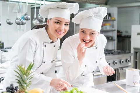 Chef Cooking, Cutting and preparing next plate Stock Photos