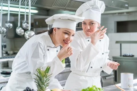 Chef Cooking, Cutting and preparing next plate Stock Photos