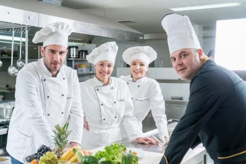 Chef Cooking, Cutting and preparing next plate Stock Photos