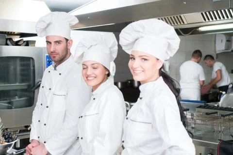 Chef Cooking, Cutting and preparing next plate Stock Photos
