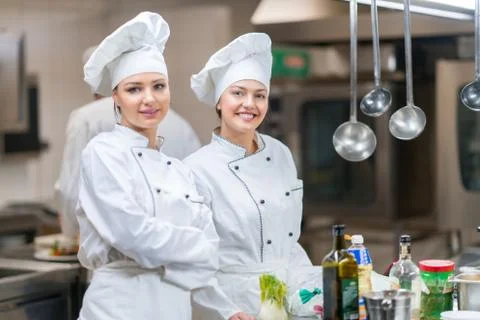 Chef Cooking, Cutting and preparing next plate Stock Photos