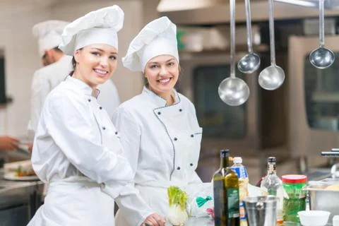Chef Cooking, Cutting and preparing next plate Stock Photos