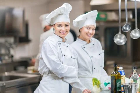 Chef Cooking, Cutting and preparing next plate Stock Photos