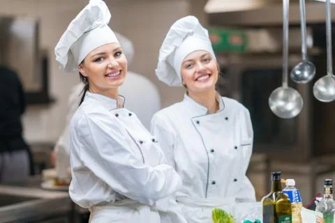 Chef Cooking, Cutting and preparing next plate Stock Photos
