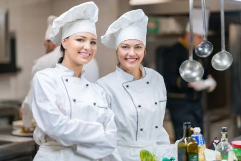 Chef Cooking, Cutting and preparing next plate Stock Photos