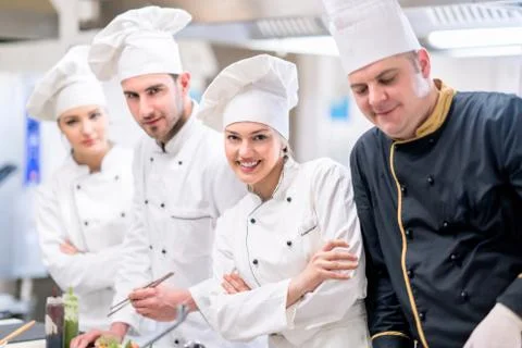 Chef Cooking, Cutting and preparing next plate Stock Photos