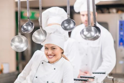Chef Cooking, Cutting and preparing next plate Stock Photos