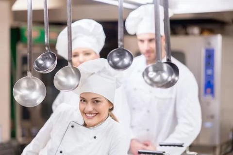 Chef Cooking, Cutting and preparing next plate Stock Photos