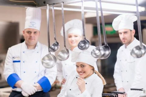 Chef Cooking, Cutting and preparing next plate Stock Photos