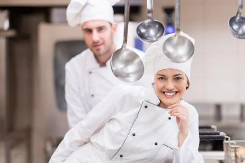 Chef Cooking, Cutting and preparing next plate Stock Photos