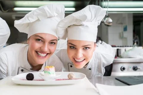 Chef Cooking, Cutting and preparing next plate Stock Photos