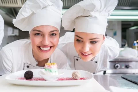 Chef Cooking, Cutting and preparing next plate Stock Photos
