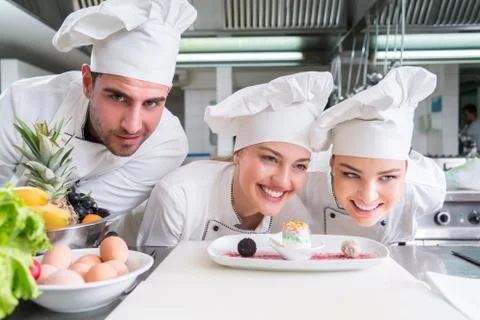 Chef Cooking, Cutting and preparing next plate Stock Photos